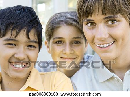 Three preteen kids smiling View Large Photo Image Stock Photo - Three preteen kids smiling. Fotosearch