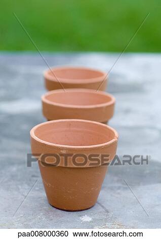 Three terracotta pots View Large Photo Image Stock Image - Three terracotta pots. Fotosearch