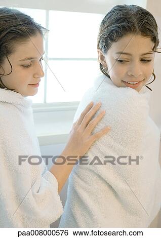 Two girls wrapped in bath towels View Large Photo Image Stock Photograph - Two girls wrapped in bath towels. Fotosearch