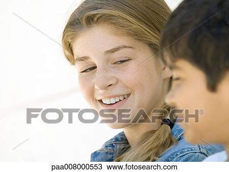 Two preteen kids, smiling View Large Photo Image Stock Image - Two preteen kids, smiling. Fotosearch