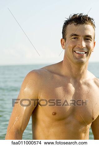 Barechested man smiling in sun View Large Photo Image Picture - Barechested man smiling in sun. Fotosearch