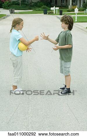 Boy and girl playing rock paper scissors in residential street View Large Photo Image Stock Image - Boy and girl playing rock paper scissors in residential street. Fotosearch