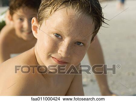 Boy at beach, portrait View Large Photo Image Picture - Boy at beach, portrait. Fotosearch