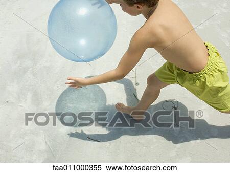 Boy catching ball on beach View Large Photo Image Stock Photography - Boy catching ball on beach. Fotosearch