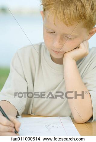 Boy doing homework View Large Photo Image Picture - Boy doing homework. Fotosearch