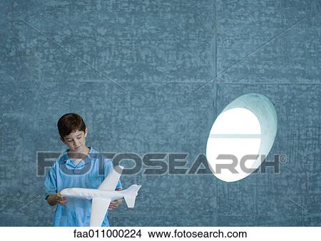 Boy holding toy airplane View Large Photo Image Picture - Boy holding toy airplane. Fotosearch