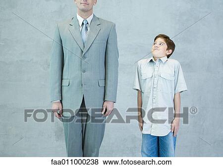 Stock Photo - Boy imitating businessman. Fotosearch