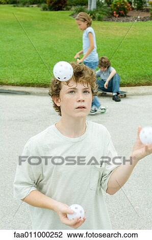 Boy juggling View Large Photo Image Stock Image - Boy juggling. Fotosearch