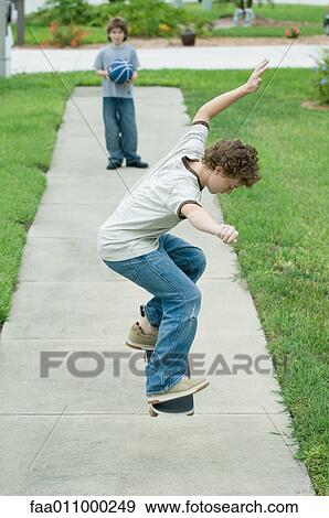 Boy jumping with skateboard View Large Photo Image Stock Photo - Boy jumping with skateboard. Fotosearch