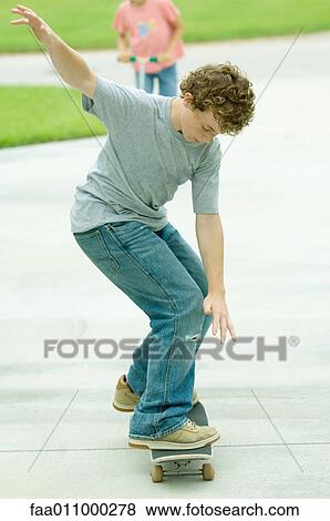 Boy on skateboard View Large Photo Image Stock Photo - Boy on skateboard. Fotosearch