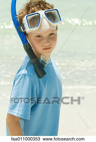 Boy wearing snorkeling gear on beach View Large Photo Image Stock Image - Boy wearing snorkeling gear on beach. Fotosearch