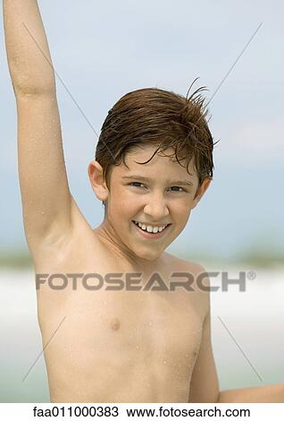 Boy with arm raised, portrait View Large Photo Image Stock Image - Boy with arm raised, portrait. Fotosearch