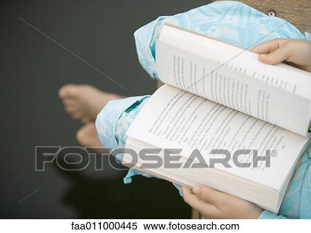 Child reading book, high angle view View Large Photo Image Stock Photography - Child reading book, high angle view. Fotosearch