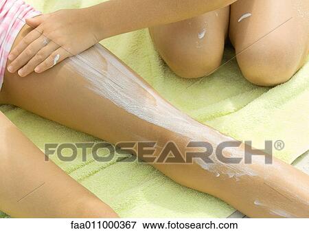Children applying sunscreen View Large Photo Image Stock Photo - Children applying sunscreen. Fotosearch