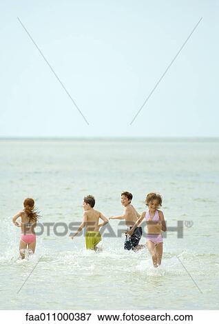 Children playing in sea View Large Photo Image Stock Photo - Children playing in sea. Fotosearch
