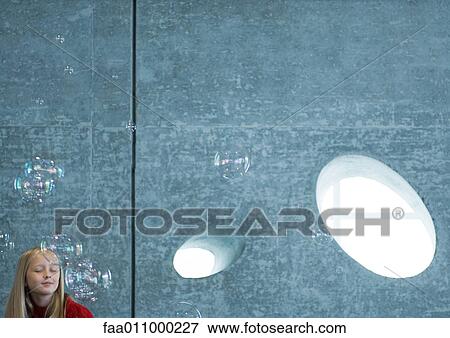 Girl dreaming, surrounded by bubbles View Large Photo Image Stock Photo - Girl dreaming, surrounded by bubbles. Fotosearch