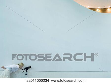Girl looking through telescope View Large Photo Image Picture - Girl looking through telescope. Fotosearch
