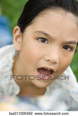 Girl making annoyed face View Large Photo Image Stock Image - Girl making annoyed face. Fotosearch