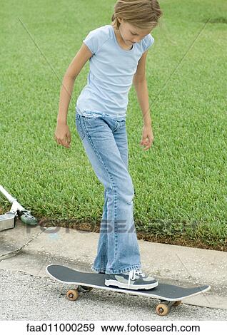 Girl on skateboard View Large Photo Image Stock Photo - Girl on skateboard. Fotosearch