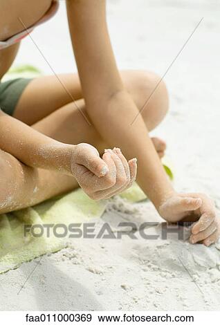 Girl playing in sand, close-up of hands View Large Photo Image Stock Photo - Girl playing in sand, close-up of hands. Fotosearch