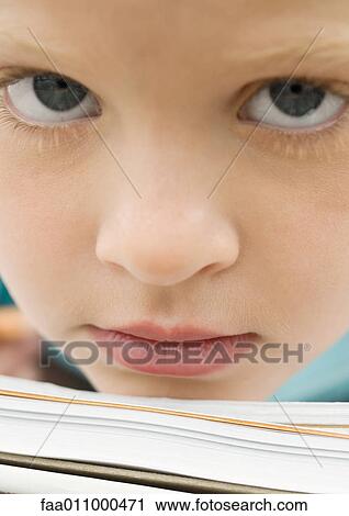Girl resting chin on notebook View Large Photo Image Stock Image - Girl resting chin on notebook. Fotosearch