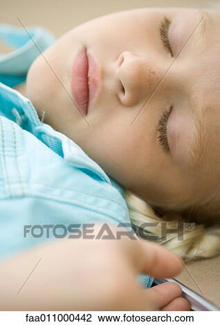 Stock Image - Girl sleeping. Fotosearch