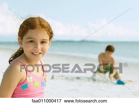 Girl smiling on beach View Large Photo Image Stock Photo - Girl smiling on beach. Fotosearch