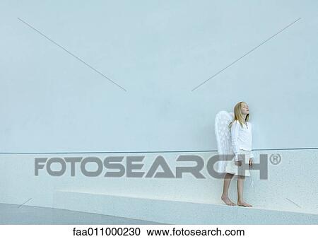 Girl wearing angel wings View Large Photo Image Stock Image - Girl wearing angel wings. Fotosearch