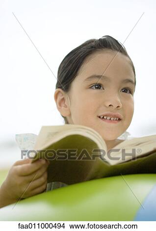 Girl with book View Large Photo Image Picture - Girl with book. Fotosearch