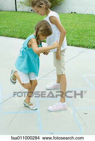 Girls playing hopscotch View Large Photo Image Picture - Girls playing hopscotch. Fotosearch