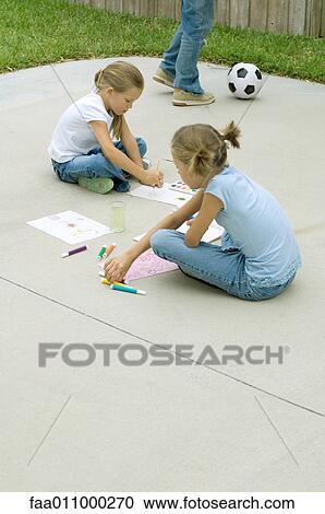 Girls sitting on driveway, painting and drawing View Large Photo Image Stock Image - Girls sitting on driveway, painting and drawing. Fotosearch
