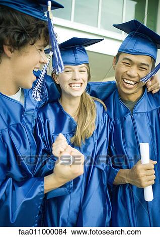 Graduates holding diplomas and laughing View Large Photo Image Picture - Graduates holding diplomas and laughing. Fotosearch