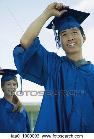 Graduates with hands on caps View Large Photo Image Stock Image - Graduates with hands on caps. Fotosearch