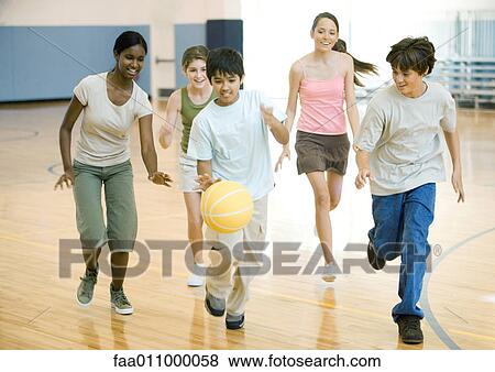 High school students playing basketball in school gym View Large Photo Image Stock Photo - High school students playing basketball in school gym. Fotosearch