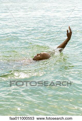 Man doing backstroke in sea View Large Photo Image Stock Image - Man doing backstroke in sea. Fotosearch