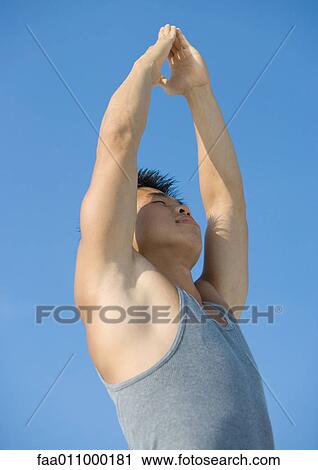 Stock Image - Man doing relaxation exercises. Fotosearch