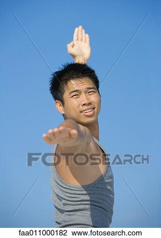 Man doing relaxation exercises View Large Photo Image Stock Image - Man doing relaxation exercises. Fotosearch
