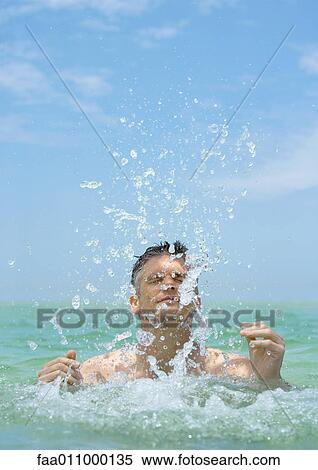 Man emerging from water, splashing View Large Photo Image Stock Photography - Man emerging from water, splashing. Fotosearch