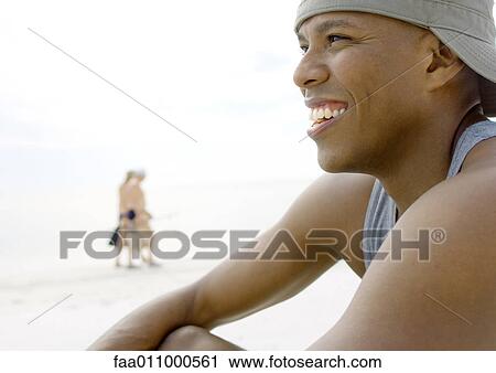 Man on beach, smiling View Large Photo Image Stock Image - Man on beach, smiling. Fotosearch