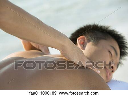 Stock Photo - Man receiving back massage. Fotosearch
