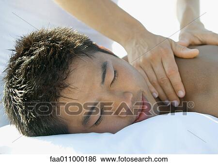 Stock Photograph - Man receiving back massage. Fotosearch