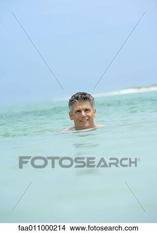 Man swimming in sea View Large Photo Image Picture - Man swimming in sea. Fotosearch