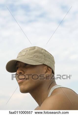 Man wearing cap, portrait View Large Photo Image Stock Photo - Man wearing cap, portrait. Fotosearch
