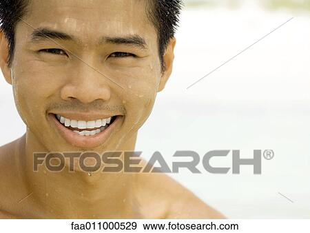 Man with wet skin, smiling View Large Photo Image Stock Photo - Man with wet skin, smiling. Fotosearch