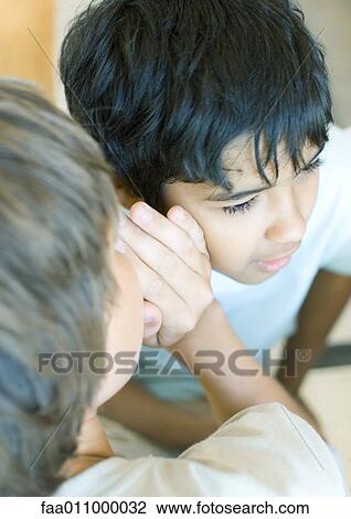 Teen boy whispering to friend View Large Photo Image Stock Image - Teen boy whispering to friend. Fotosearch