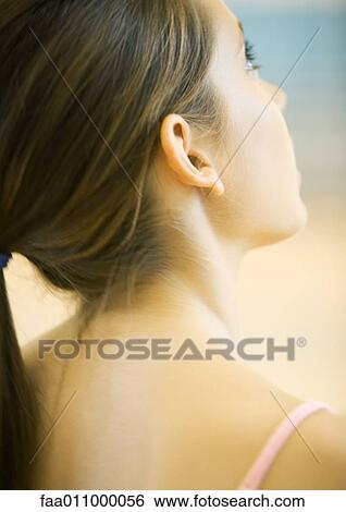 Teen girl, close-up of head and shoulders, rear view View Large Photo Image Stock Photograph - Teen girl, close-up of head and shoulders, rear view. Fotosearch