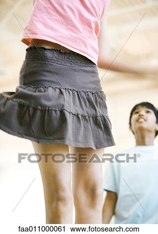 Teen girl jumping, mid section View Large Photo Image Stock Image - Teen girl jumping, mid section. Fotosearch