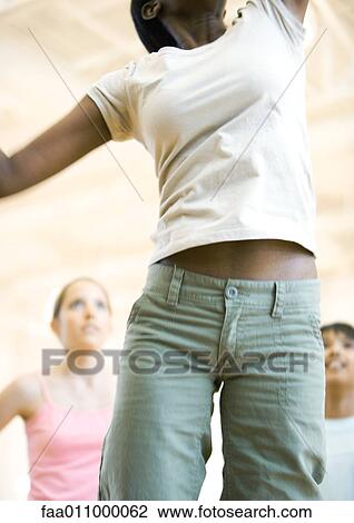 Teen girl jumping, mid section View Large Photo Image Stock Image - Teen girl jumping, mid section. Fotosearch