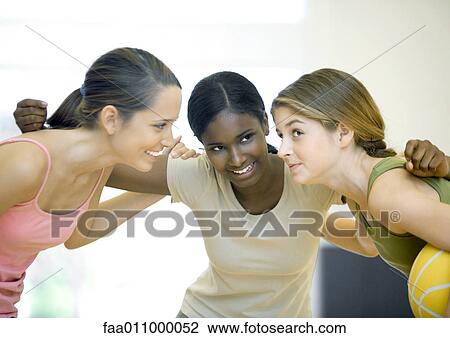 Teen girls huddling with basketball View Large Photo Image Stock Image - Teen girls huddling with basketball. Fotosearch