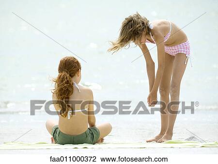 Two girls on beach View Large Photo Image Stock Image - Two girls on beach. Fotosearch